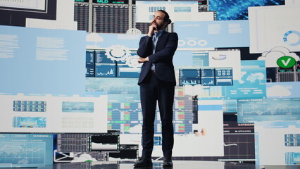 Business analyst reflecting on monthly company results for development strategy, reviewing the...