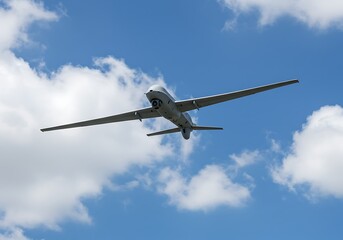 Aerial drone surveillance uav flying in blue sky with clouds for security and military applications use