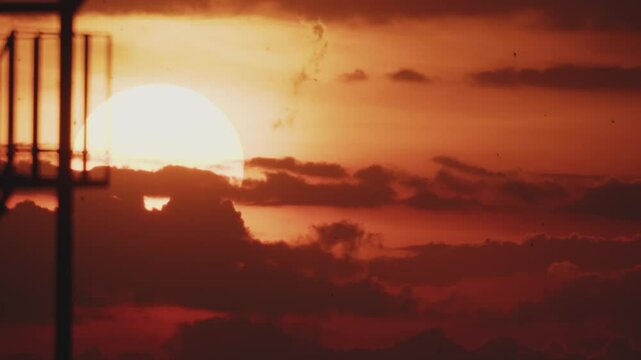 Big sun at sunset in real time