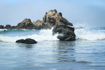 waves crashing on rocks