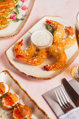 a luxurious dinner in a restaurant with seafood in delicate pink tones