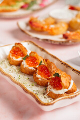 a luxurious dinner in a restaurant with seafood in delicate pink tones