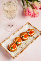 a luxurious dinner in a restaurant with seafood in delicate pink tones