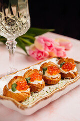 a luxurious dinner in a restaurant with seafood in delicate pink tones