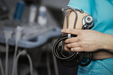 Medicine. Doctor holds his stethoscope to insinuate that it's time for a check up, professional emergency healthcare assistance service concept. Professional doctor ready to listen lungs or heart.