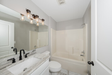 bathroom has been updated with a new vanity new tile and new fixtures installed by a professional