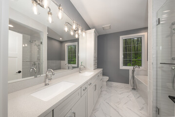 bathroom has been updated with a new vanity new tile and new fixtures installed by a professional