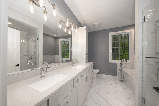 bathroom has been updated with a new vanity new tile and new fixtures installed by a professional