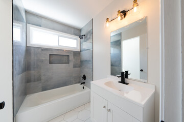 bathroom has been updated with a new vanity new tile and new fixtures installed by a professional