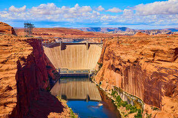 Glen Canyon Dam and Red Rock Cliffs Over Colorado River Aerial Fly Through