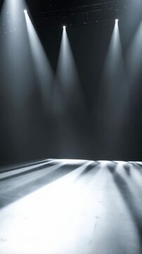 Stage lighting with four bright spotlights shining onto a dark concrete floor creating a dramatic and atmospheric scene for performance