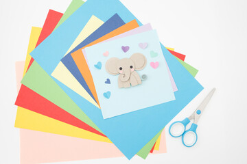 Flat lay of multicolored paper sheets in geometric layout, useful for graphic design, DIY craft kits, color palette inspiration, educational visuals, creative product presentation,