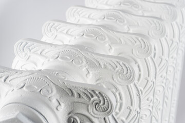 pattern on the ribs of a white, concrete battery