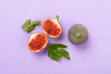 Fresh tasty fig fruits on color background, top view