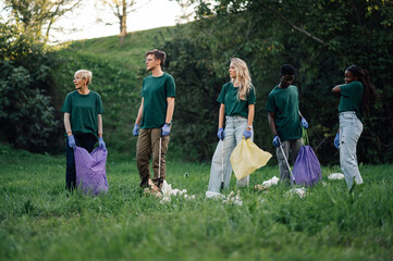 Group of volunteers picking up trash in a park