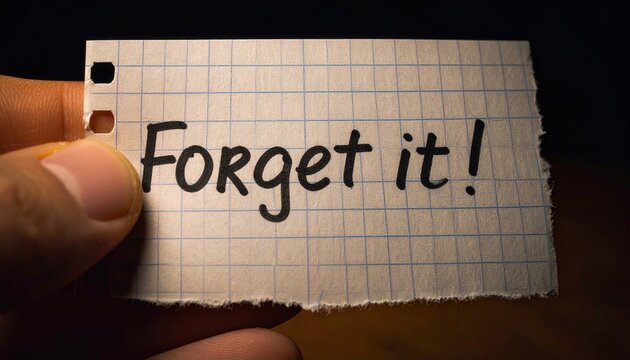 Hand Holding a Note with Forget It! Written