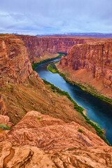 Colorado River Winding Through Red Cliffs and Green Banks Glen Canyon High View