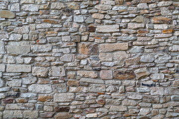 Detail of a traditional dry stone masonry. Old castle wall. Stone wall