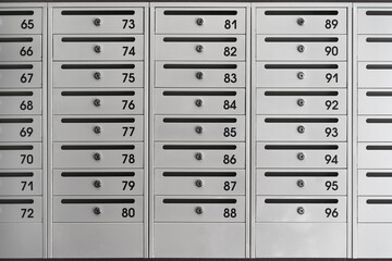 Installation of new mailboxes in the entrance of a multi-storey apartment building. New mailboxes with room numbers