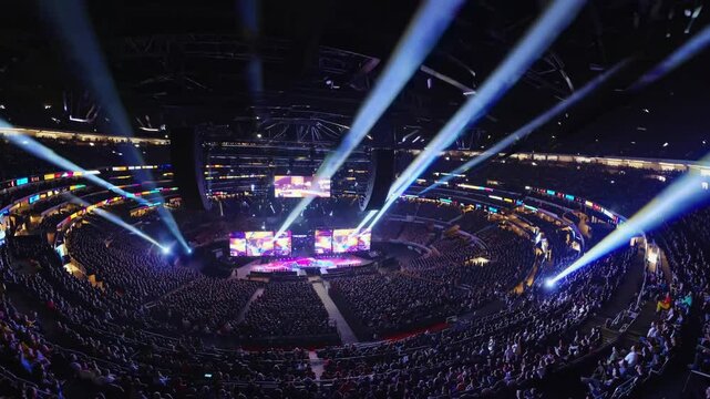 Exciting arena show with audience and light beams