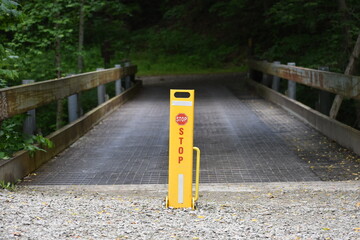 danger stop pedestrian crossing on old bridge