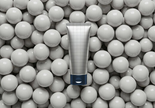 Silver Vertical Tube Packaging Mockup on Balls
