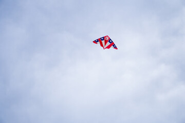 A kite decorated with the Chilean flag soars in the sky during September 18th celebrations. A patriotic moment capturing freedom, tradition, and joy in the air.