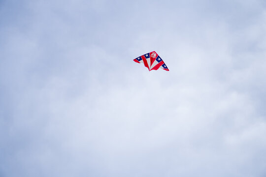 A kite decorated with the Chilean flag soars in the sky during September 18th celebrations. A patriotic moment capturing freedom, tradition, and joy in the air.