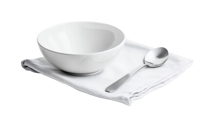 White ceramic bowl with spoon on napkin for dining presentation