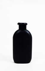 black plastic lotion bottle isolated on white background, Shampoo bottle, Plain black cosmetic bottle for product advertising
