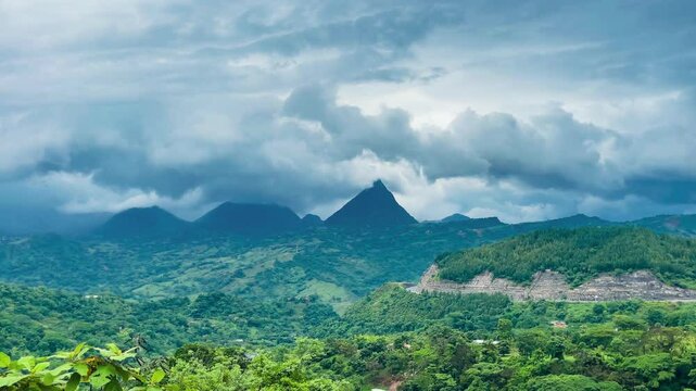 Cerro Tusa mountain peak with moody storm clouds in green hills of Antioquia