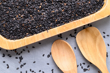 Black sesame seed with wooden spoon, Healthy eating, Top view