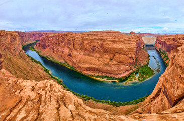 Glen Canyon Dam and Colorado River Winding Through Red Sandstone Aerial Panorama