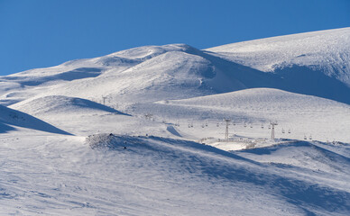 Snowy Mountain with Ski Slopes and Chairlifts