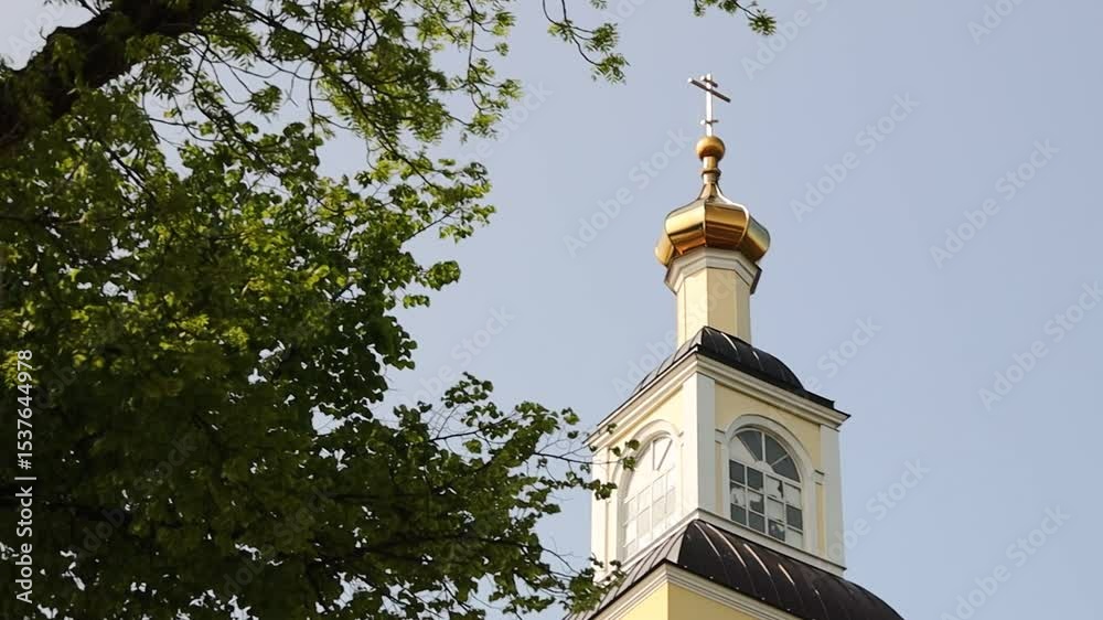 Aufkleber A historic clock tower with a functional weather vane on top, suitable for use in scenes depicting nostalgia, old town charm, or historical settings