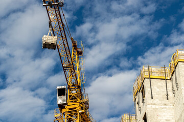 crane carries some products at a construction site in a city in Brazil