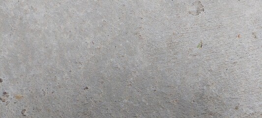 Superficie de concreto con una textura uniforme, su color es gris claro, sin elementos adicionales visibles.