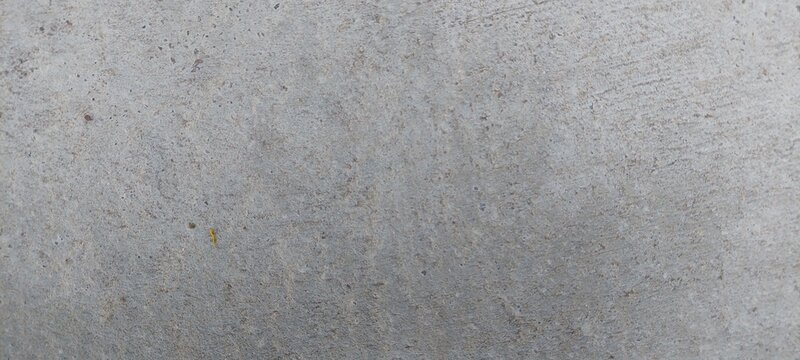 Superficie de concreto con una textura uniforme, su color es gris claro, sin elementos adicionales visibles.