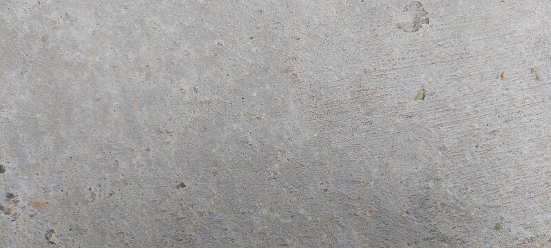 Superficie de concreto con una textura uniforme, su color es gris claro, sin elementos adicionales visibles.