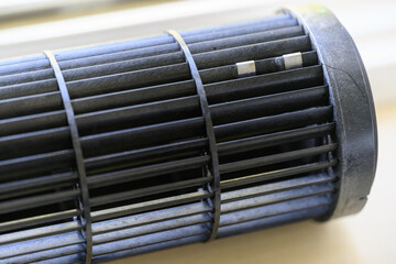 Two balancing plates on the rotating part of the fan.