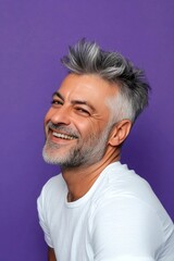 Obraz premium Visual design of style for aging men. A vibrant male with a lively and glowing personality. Chic men's rocker haircut - midlife arabian man with middle hair. Purple solid background.