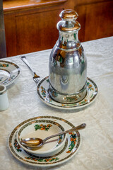 Antique place setting in luxury mid century rail dining car
