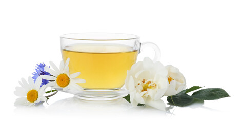 Aromatic herbal tea in glass cup and flowers isolated on white