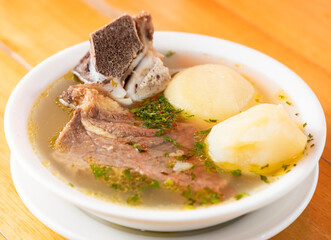 Beef rib broth soup with potatoes - Traditional Colombian breakfast