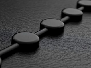 Abstract arrangement of dark rounded shapes on textured backdrop element