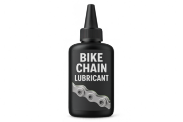 Black plastic bottle containing bike chain lubricant features a nozzle and showcases a clean, transparent background for easy viewing