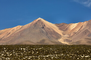 The eastern slopes of Volcán Pichu Pichu catch the first light of day—rugged, remote, and rich...