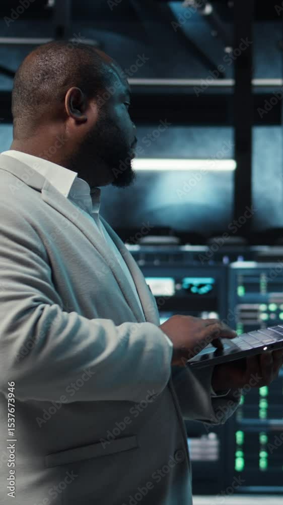 Poster vertical video programmer in data center using laptop, employing ai machine learning models. worker 