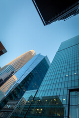 Skyscrapers rise against a clear sky in San Francisco, USA. The Salesforce Tower stands tall, reflecting the city's modern architecture and economic power.
