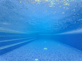 Underwater view of the pool mosaic tile and water jets